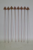 A set of eight cast iron gothic style plant stakes, 106cm long