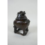 A Chinese bronze censer in the form of a kylin, impressed 4 character mark to base, 12cm high