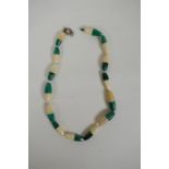 A bone and malachite beaded necklace, clasp AF, 48cm long