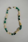 A bone and malachite beaded necklace, clasp AF, 48cm long