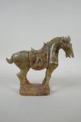 A Chinese carved celadon jade Tang style horse, 18cm high