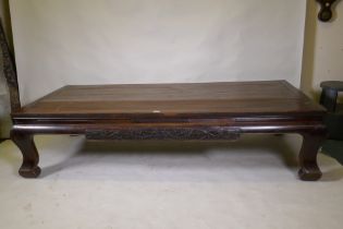 An antique Chinese soft-wood opium bed, with carved decoration, 198 x 94cm 47cm high