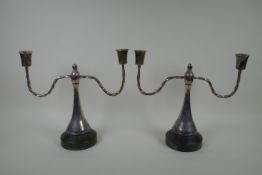 A pair of antique silver plated two branch candlesticks, 29cm high