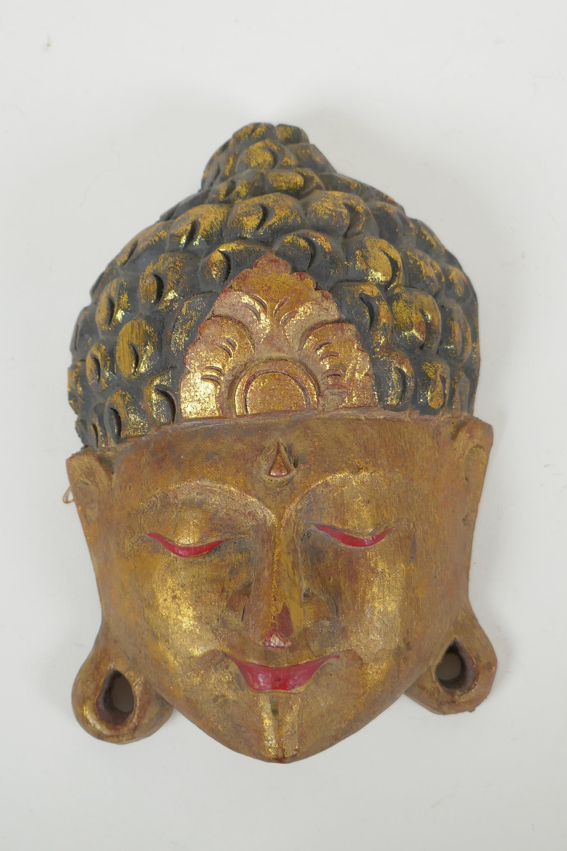 An Indian carved and painted wood Ganesh wall mask and another carved and gilt Buddha mask, - Image 2 of 3