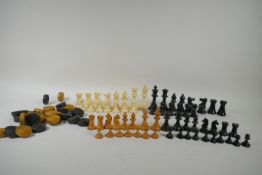 A box wood and ebony chess set, king 7cm high, and an early C20th composition set, king 9cm high,