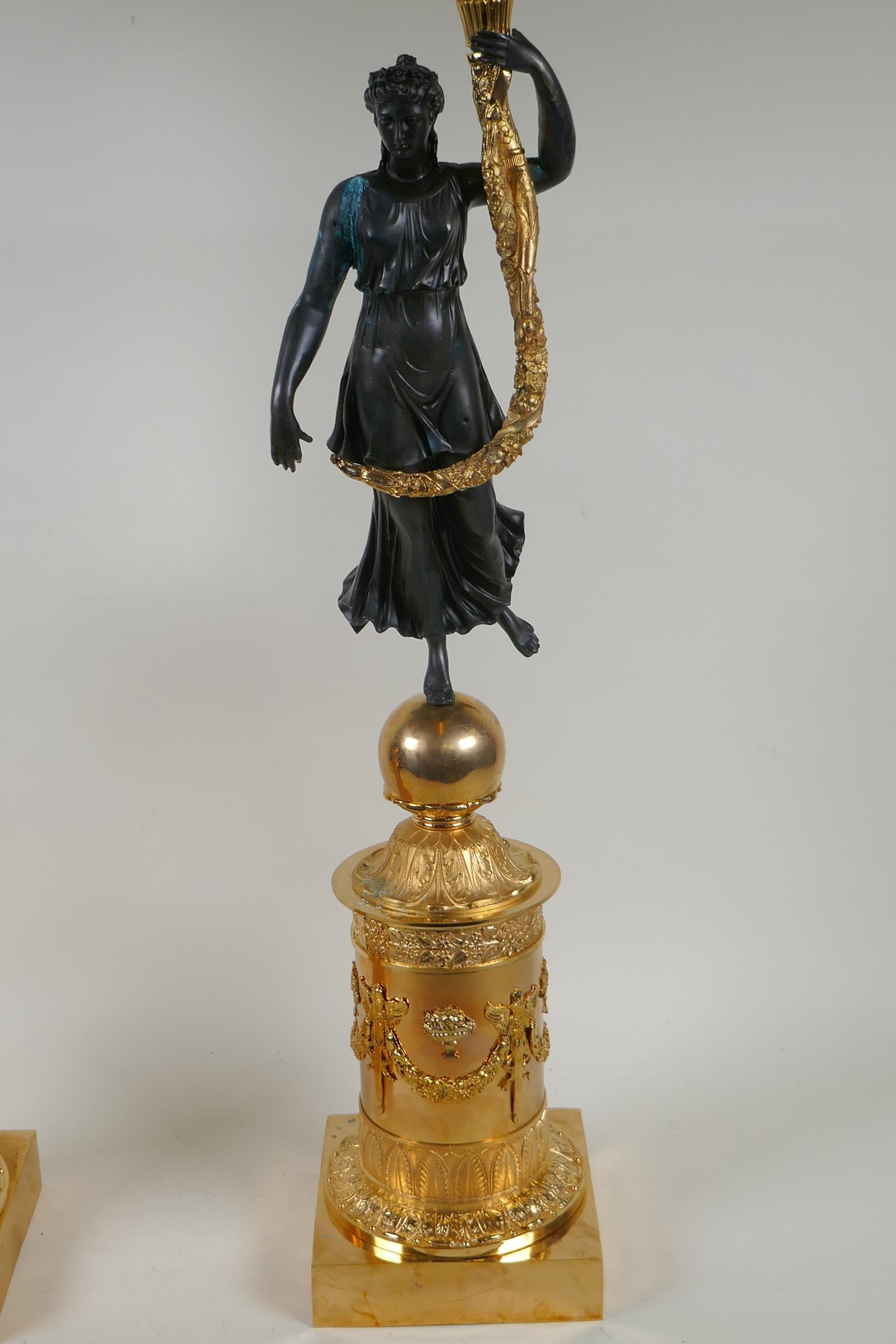 A pair of Regency style bronze and ormolu four branch candelabra in the form of classical women - Image 5 of 6