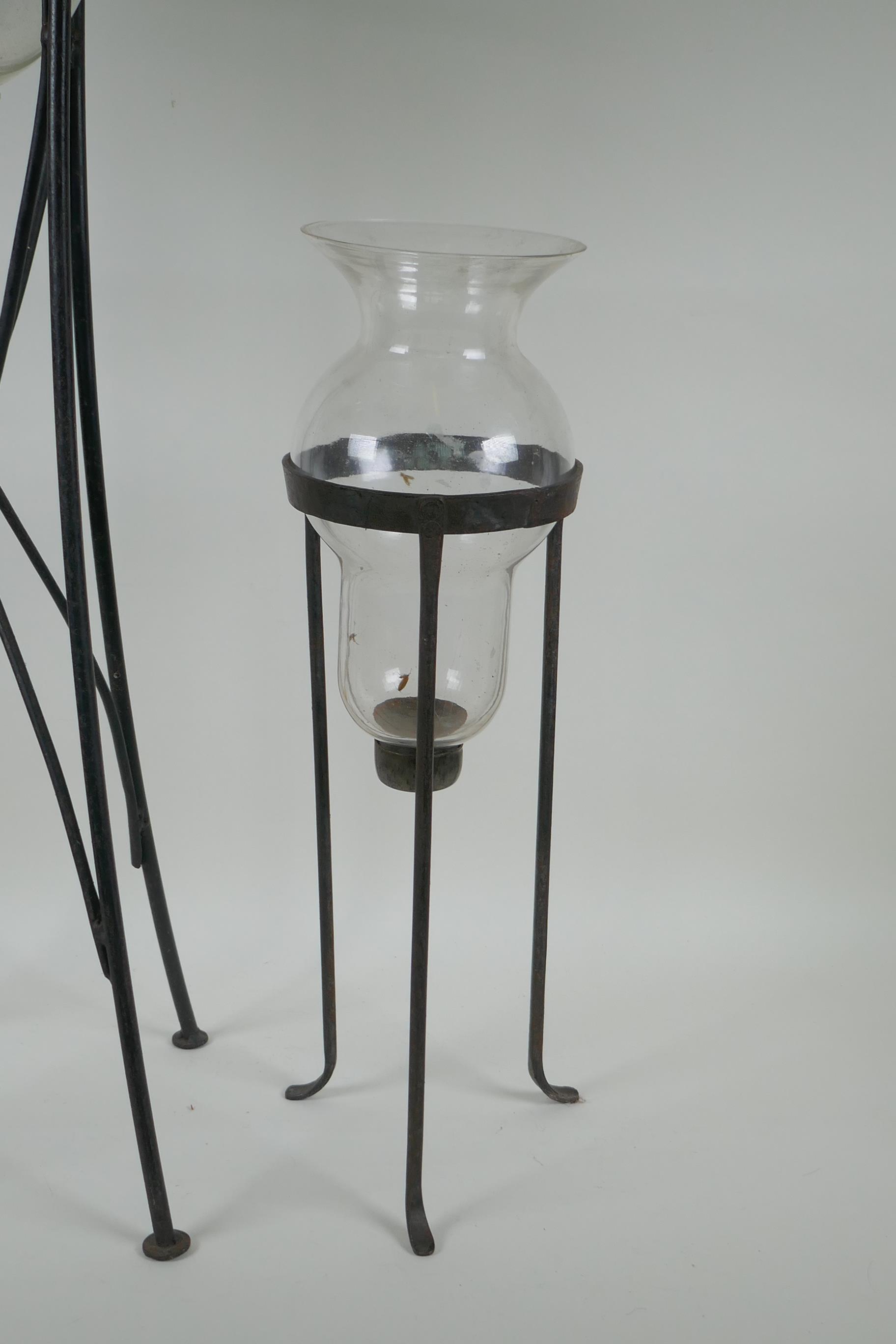 A glass hurricane vase on a wrought iron stand, and another, largest 76cm high - Image 3 of 3