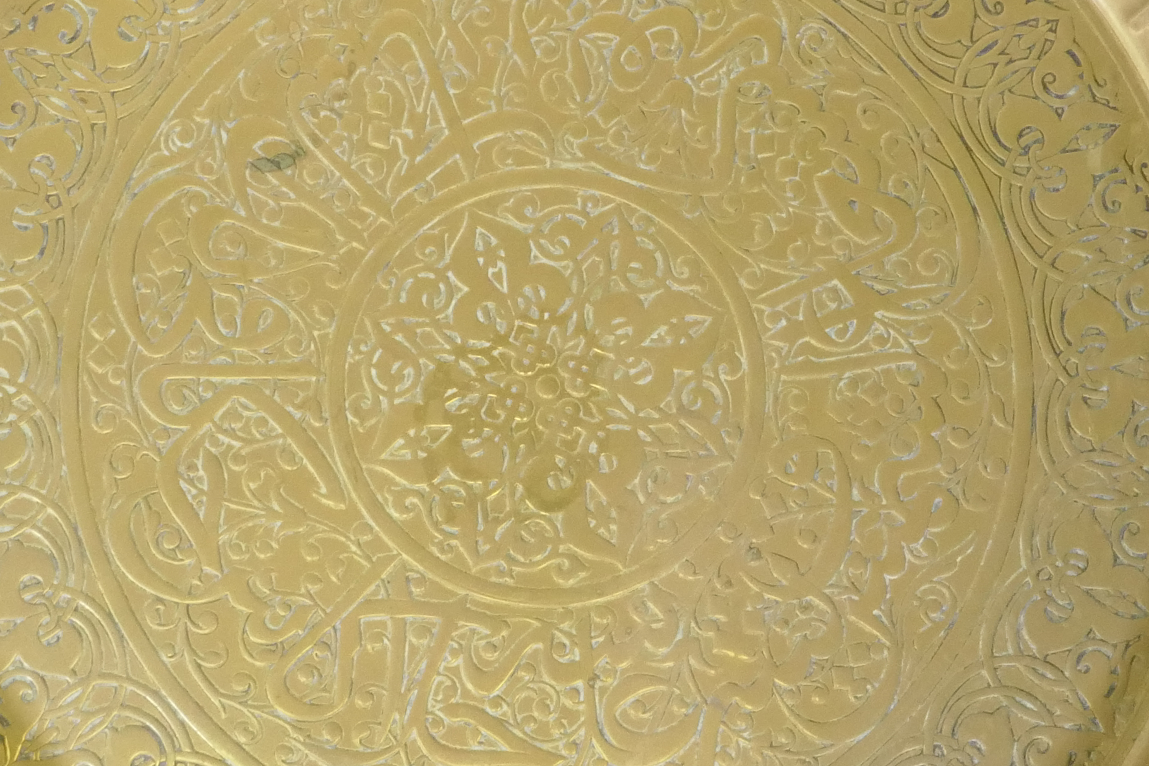 An Islamic brass tray with script decoration, together with another larger decorated with Islamic - Image 3 of 9