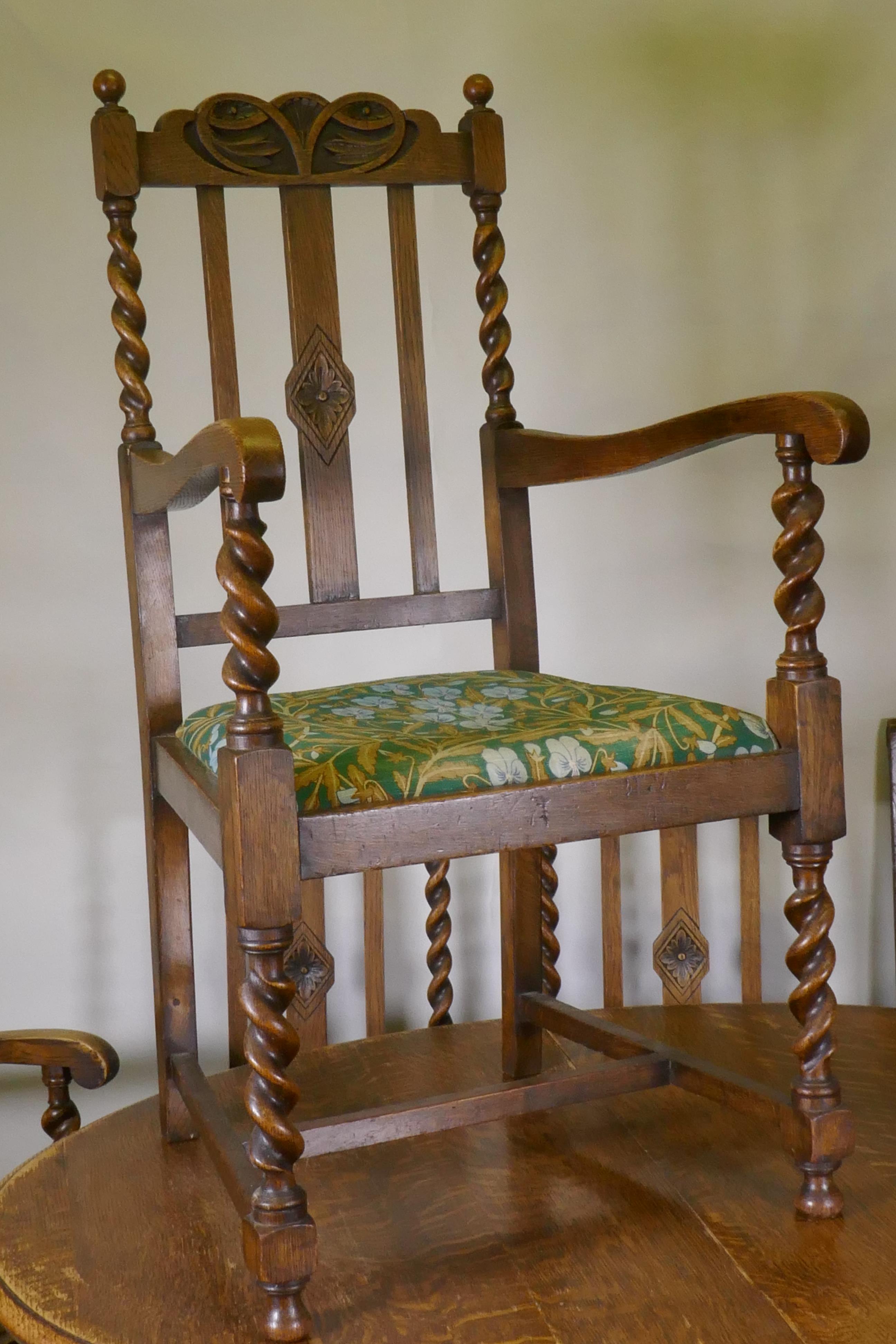 An early C20th oak wind out dining table, with extra leaf, raised on handed barley twist supports, - Image 3 of 7