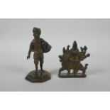 An Indian cast bronze Sikh watercarrier, and an Indian gilt bronze figure of the goddess Mata,