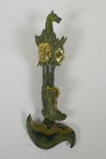 A Tibetan filled bronze kartika with gilt highlights, 28cm long