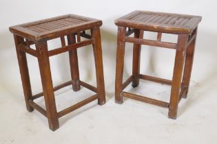 A pair of Chinese wood stools with bamboo seats, 27 x 38cm, 50cm high