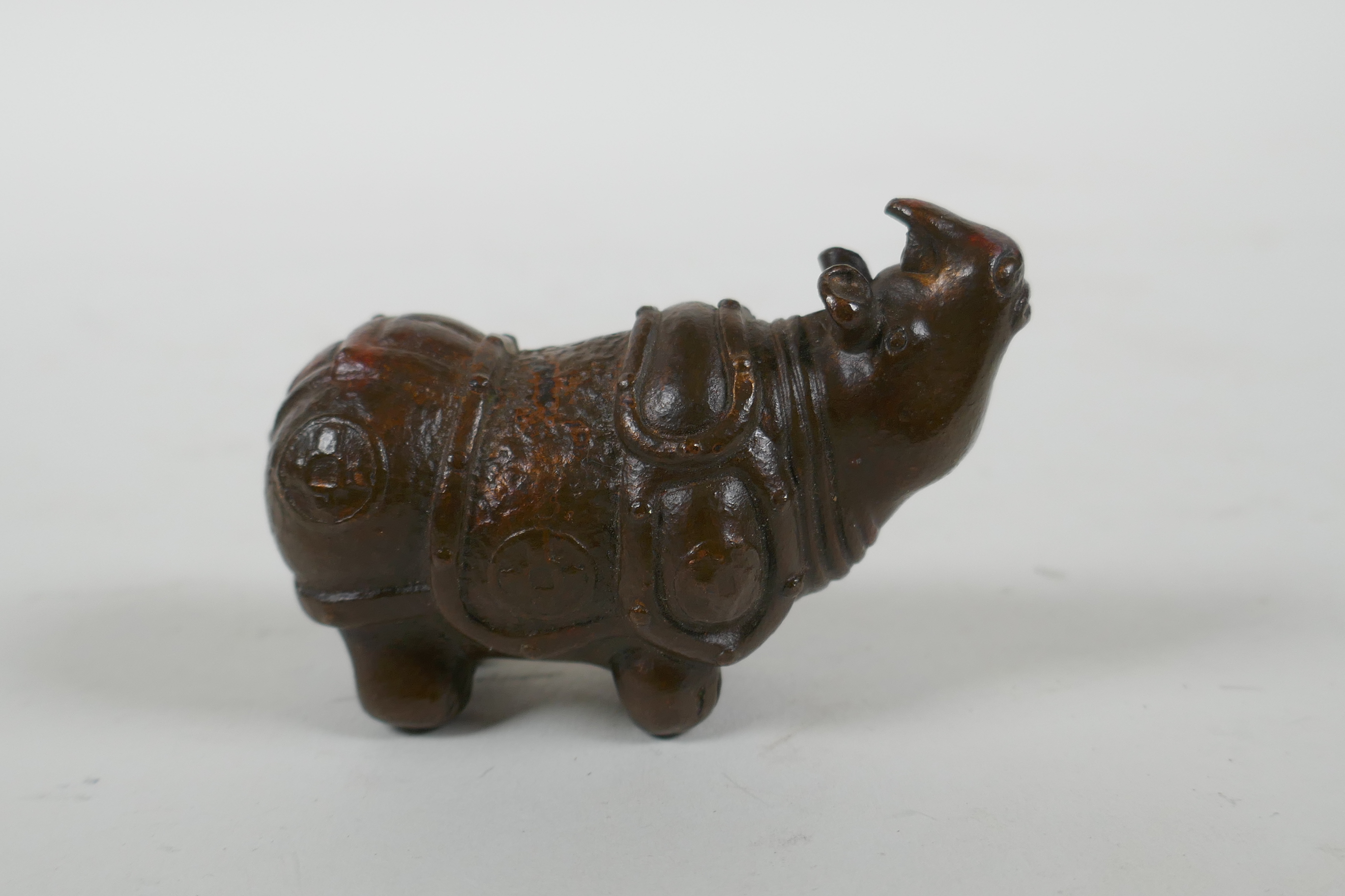A Japanese style bronze okimono rhinoceros, 6.5cm long - Image 2 of 3