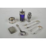 A quantity of hallmarked silver to include a George III pepper sifter with a blue glass liner by