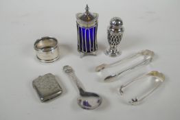 A quantity of hallmarked silver to include a George III pepper sifter with a blue glass liner by