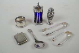 A quantity of hallmarked silver to include a George III pepper sifter with a blue glass liner by