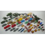 A collection of vintage die cast metal cars, trucks, military vehicles and farming vehicles,