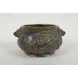 A Chinese bronze censer with dragon mask handles and raised dragon decoration, Xuande 6 character