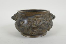 A Chinese bronze censer with dragon mask handles and raised dragon decoration, Xuande 6 character