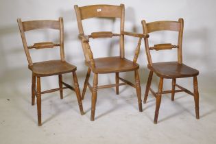 A C19th Oxford bar back elbow chair and two standards, all with elm seats