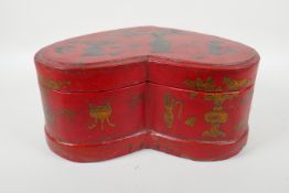 A Chinese red lacquered heart shaped box decorated with objects of virtue in gilt, 32 x 26cm