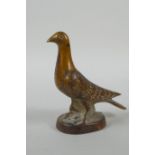 A vintage cast bronze paperweight in the form of a dove, 10cm high