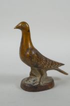 A vintage cast bronze paperweight in the form of a dove, 10cm high