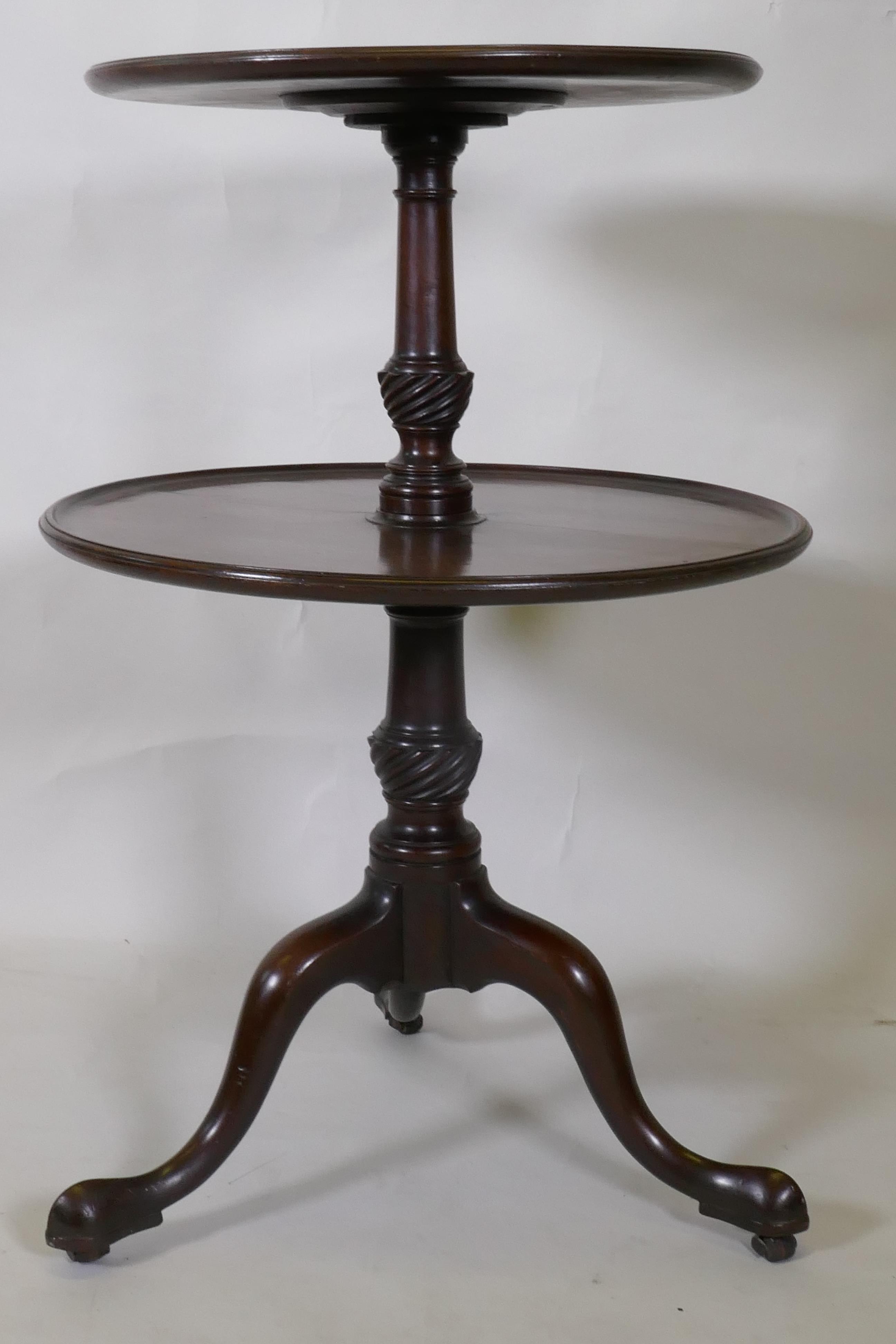 A Georgian mahogany two tier dumb waiter, raised on carved and turned column and tripod supports - Image 3 of 5