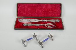A pair of silver plated fish servers with pierced fish decoration to the blade, and a pair of silver