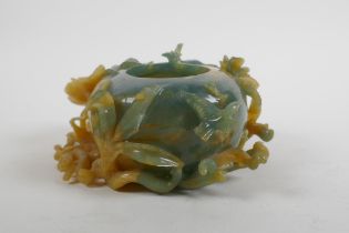 A Chinese bi colour jade pot decorated with birds and lotus flowers, AF, 16cm wide