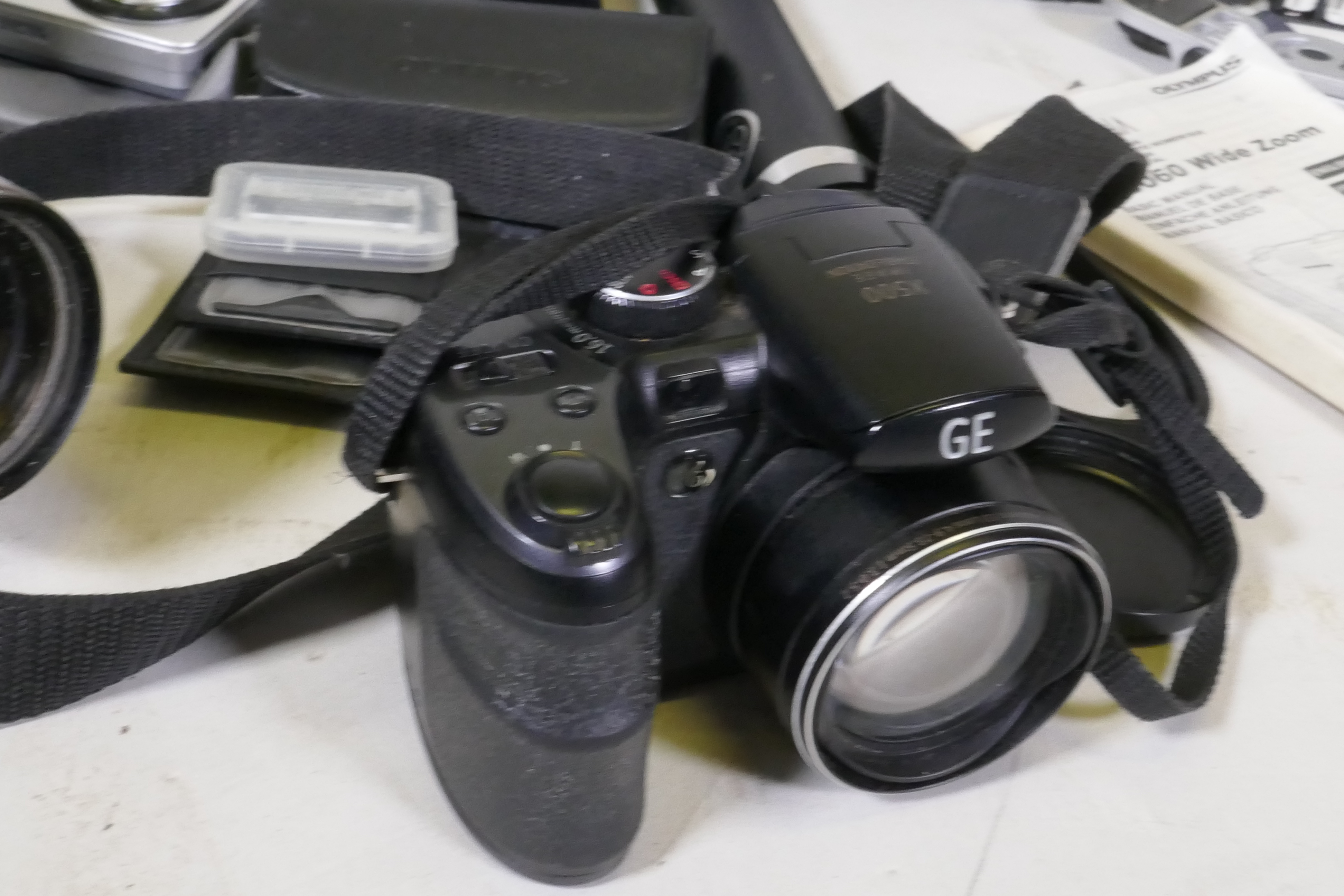 Digital cameras, Panasonic TZ10; Panasonic TZ5; Olympus C5060 wide zoom; GE X500 Aberg Rest; Fuji - Image 6 of 6