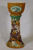 A Chinese Sancai glazed ceramic jardiniere and pierced stand with dragon decoration, 94cm high