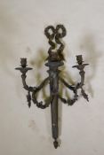 An Empire style three branch wall sconce in the form of an arrow quiver, with ribbons and floral