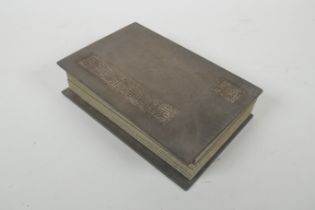 A Chinese wood and silk bound book containing white jade table pages with chased and gilt