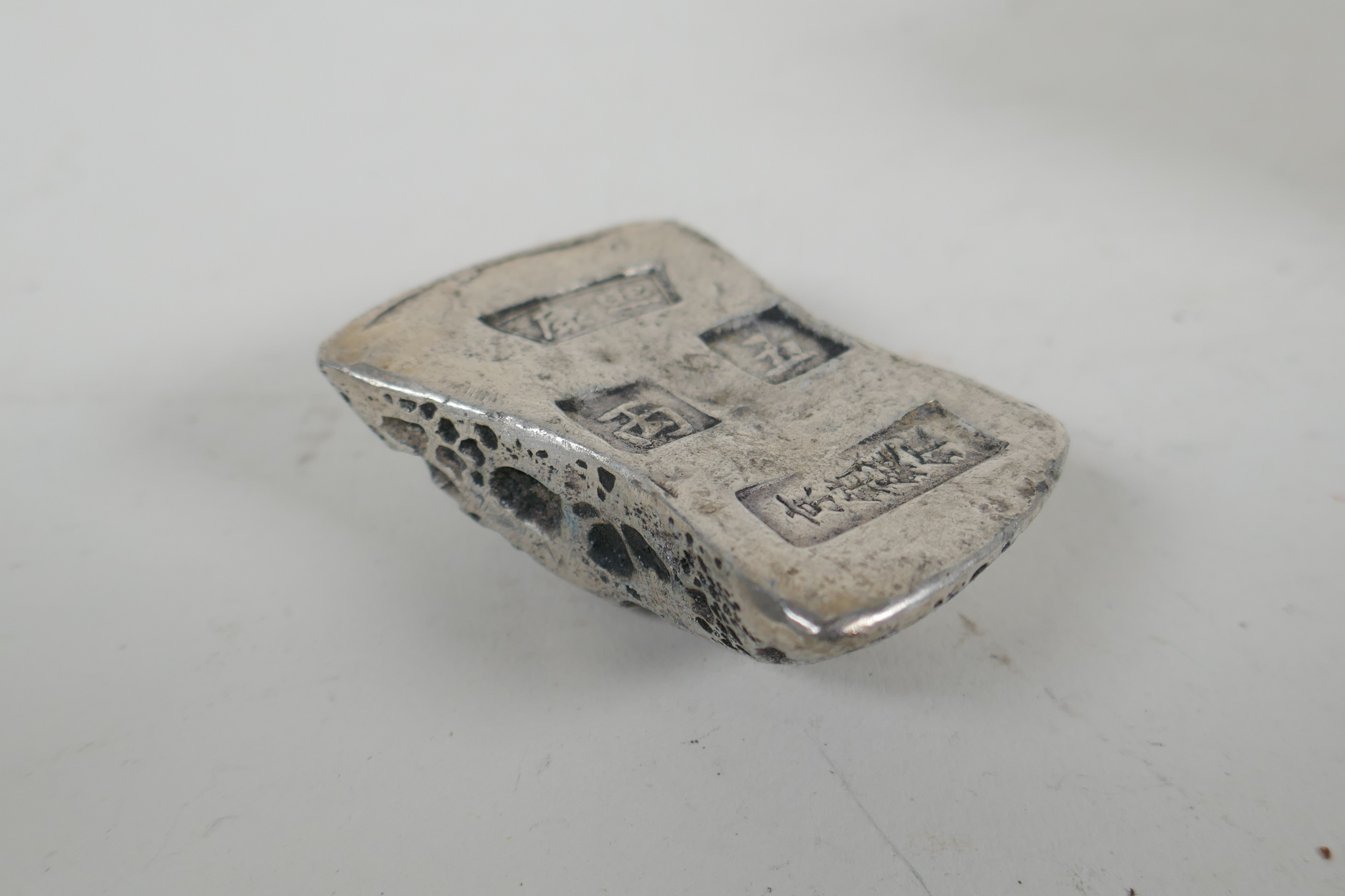 A Chinese white metal trade token/ingot, and another smaller, 10 x 8cm - Image 4 of 5