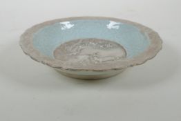 A Chinese celadon ground porcelain dish with lobed rim, and silver glazed details, decorated with