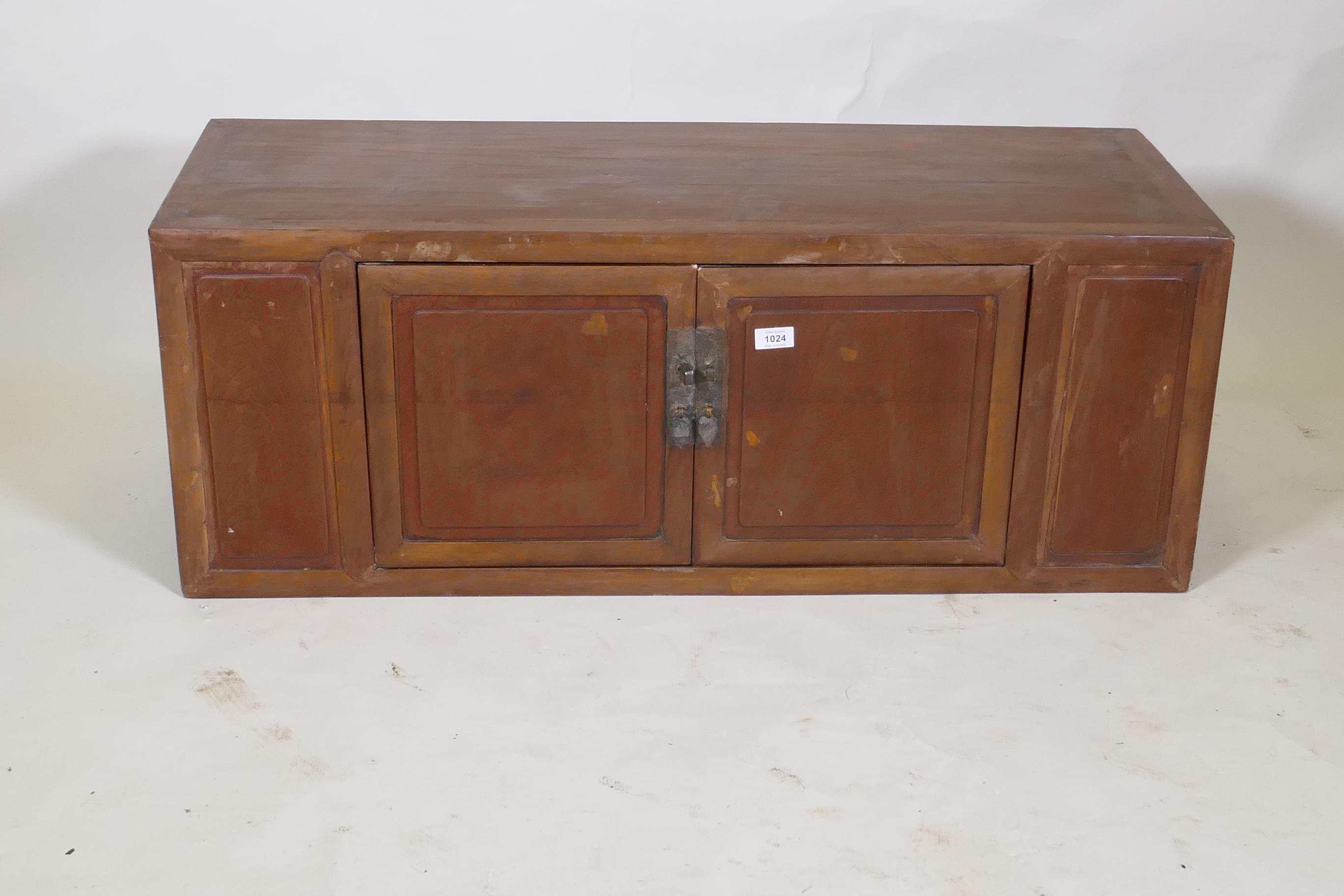 A Chinese two door desk top cabinet, 107 x 40cm, 40cm high