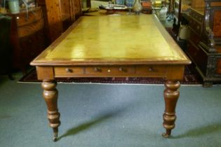 A large C19th eight drawer mahogany partners library table/desk, with leather inset top, raised on