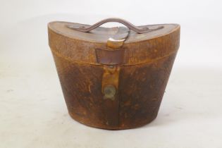 A C19th leather hat box with red silk lining, 26cm high