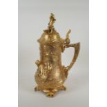 A large secessionist style ormolu tankard decorated with nymphs, putti and fauns, 41cm high