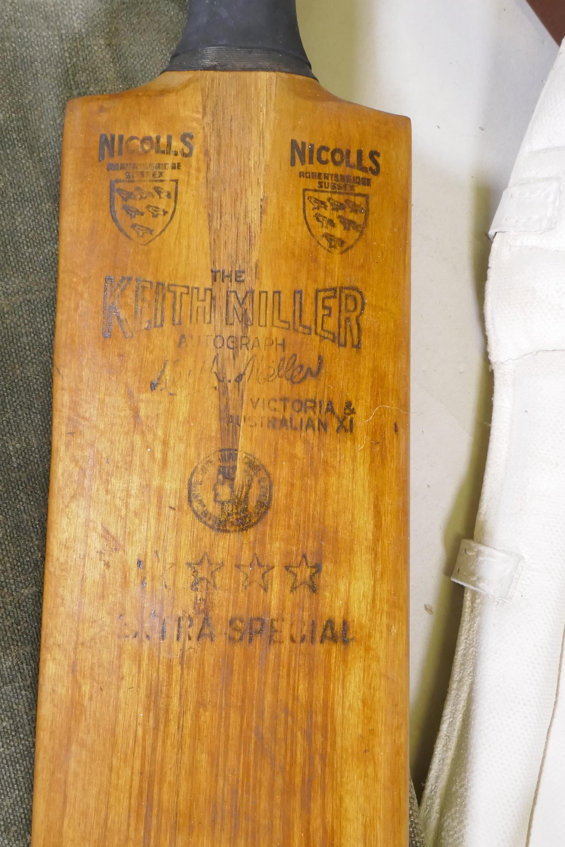 A collection of vintage cricket equipment to include two Keith Miller autograph bats, a set of pads, - Image 3 of 7