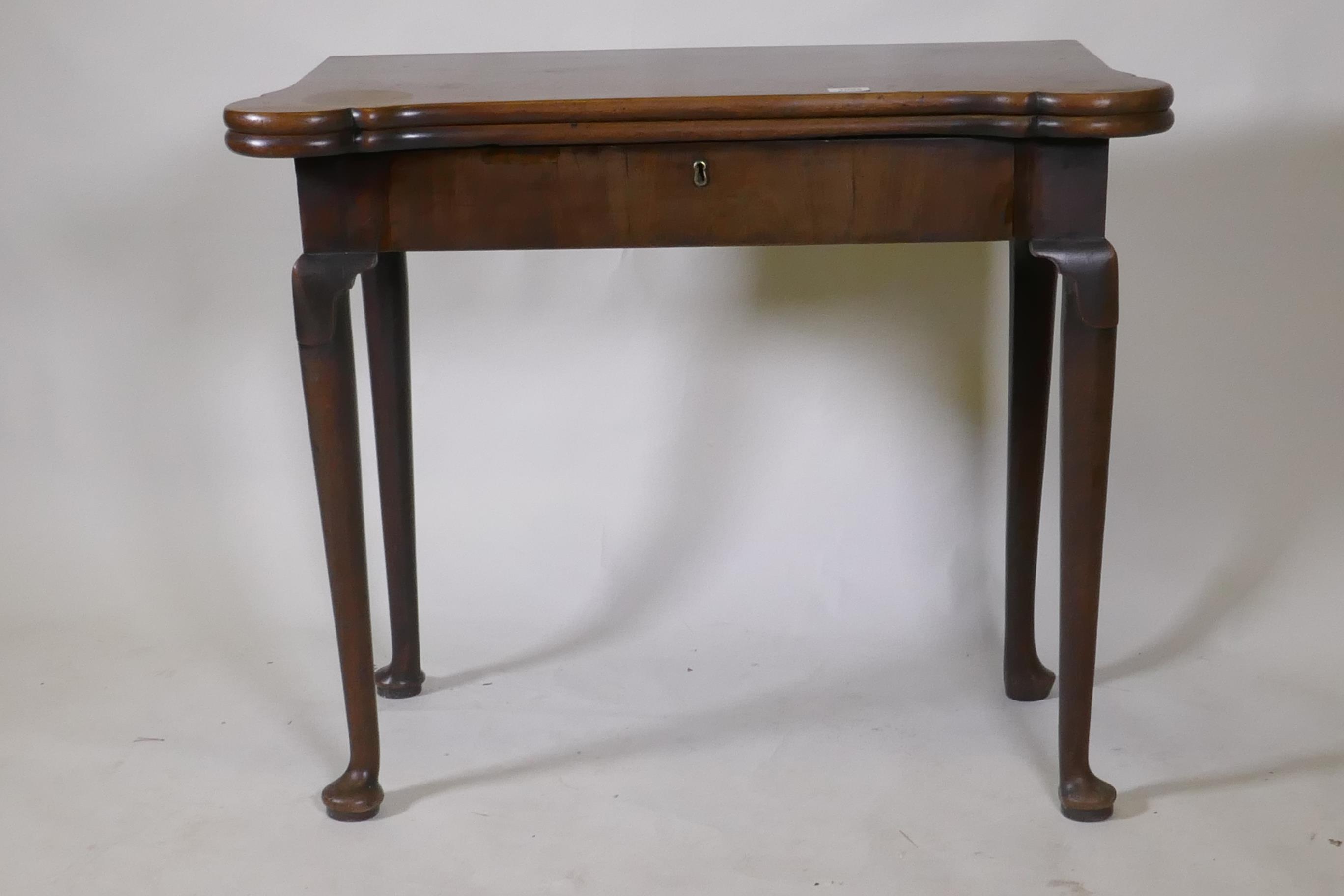 A Georgian mahogany fold over tea table with inlaid games top, shaped top and frieze drawer, - Image 2 of 5