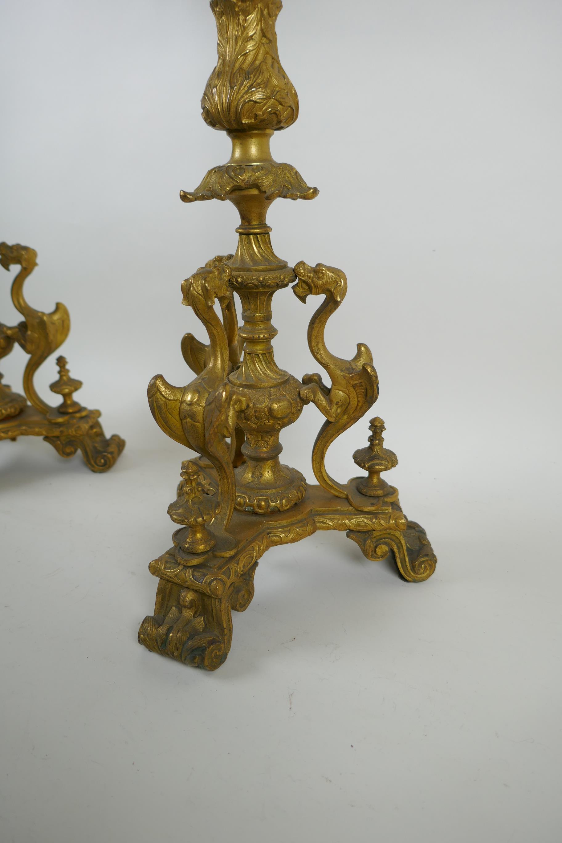 A pair of French ormolu five branch candlesticks on a tripod base with griffin decoration, the - Image 4 of 5