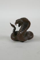 A Japanese style bronze okimono cobra, 4cm high