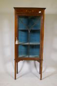 An Edwardian inlaid mahogany display cabinet with painted decoration and single glazed door,