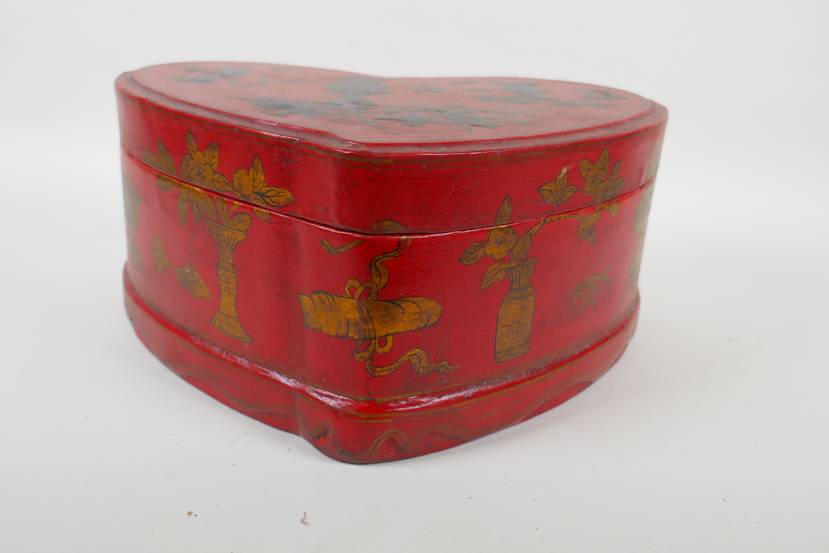A Chinese red lacquered heart shaped box decorated with objects of virtue in gilt, 32 x 26cm - Image 6 of 6