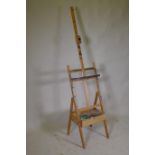 An artist's adjustable easel with single drawer, 190cm high