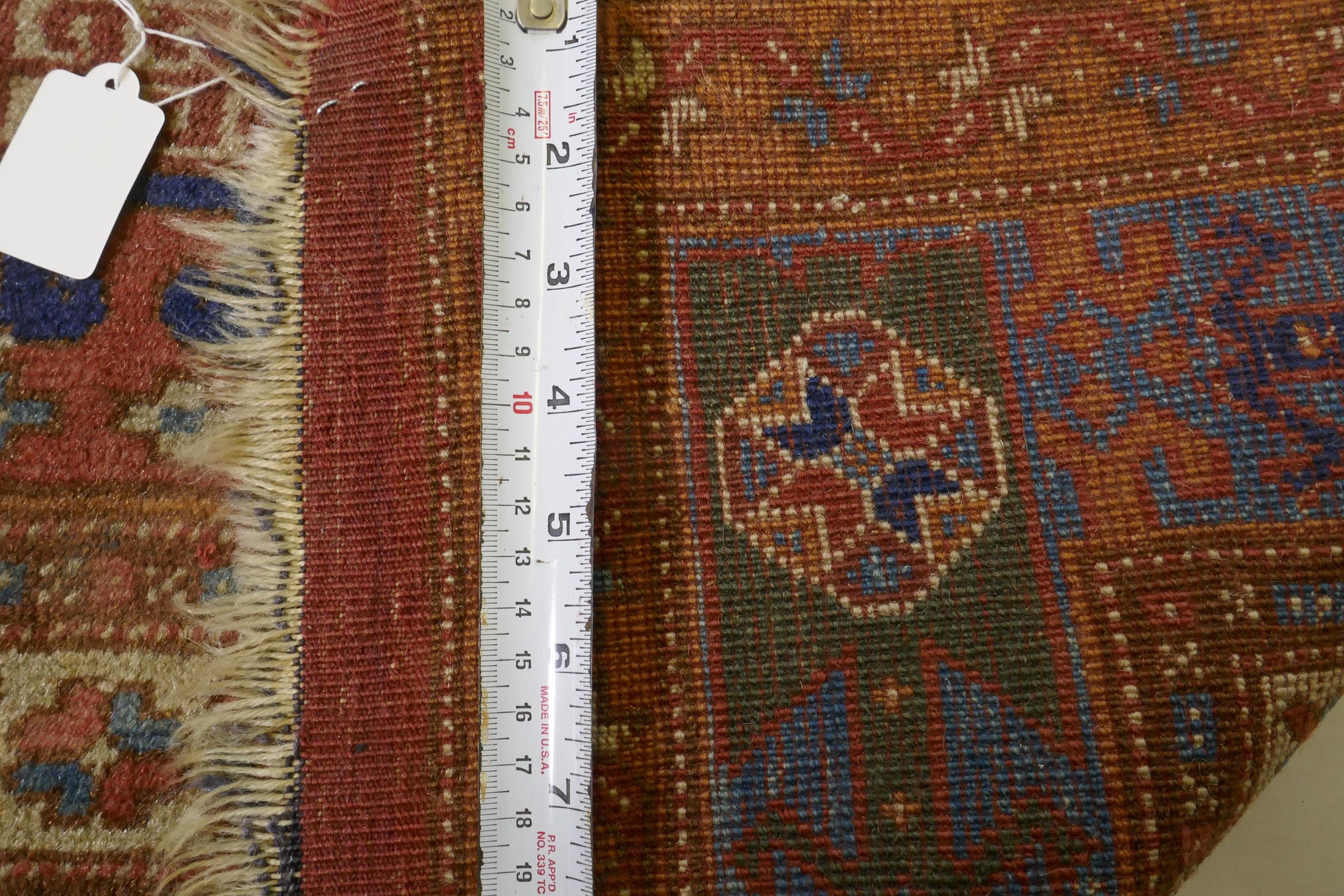 An antique Bergama carpet, with geometric designs on a terracotta coloured field and soft sheen to - Image 6 of 6