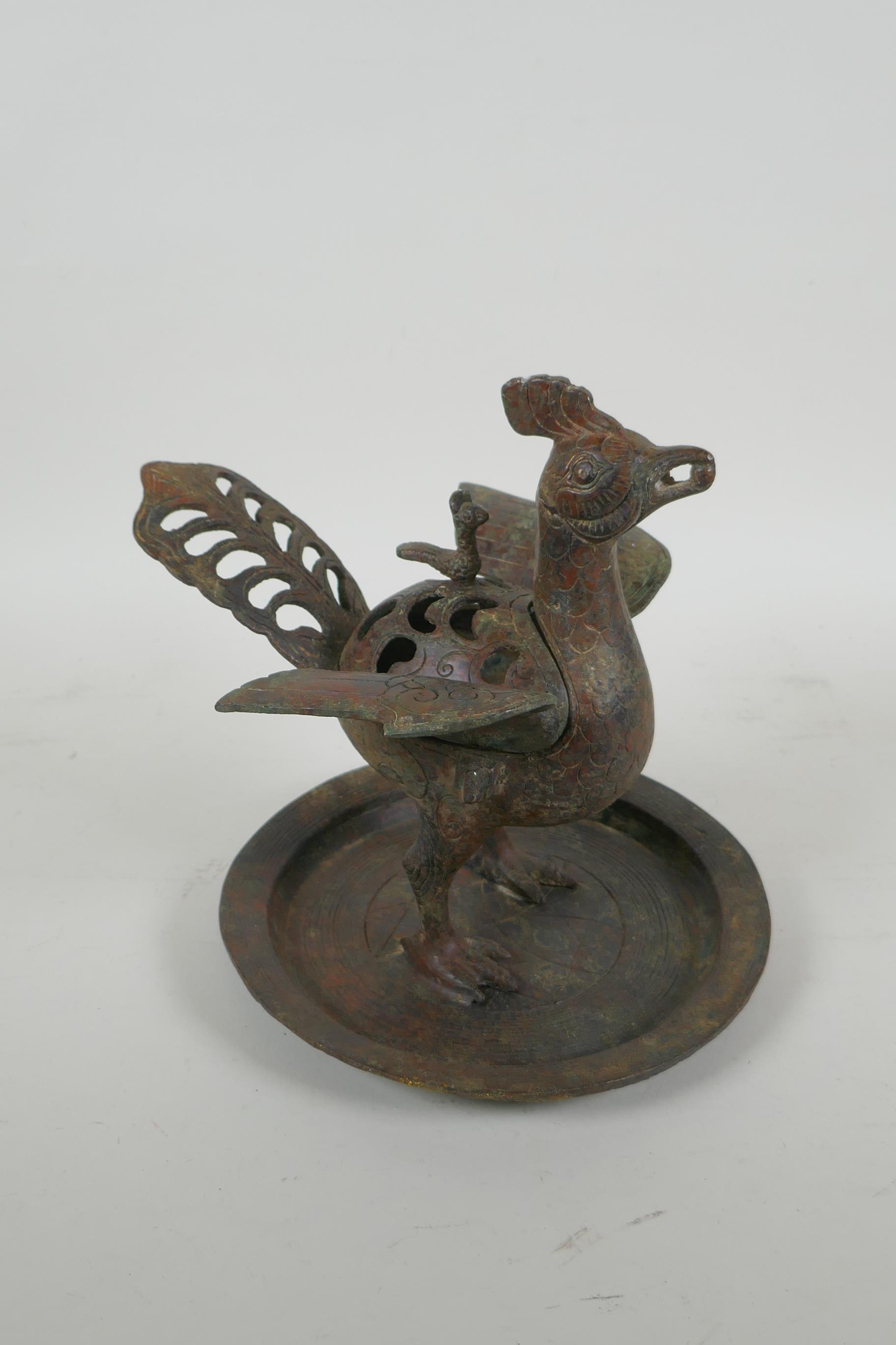 A Chinese archaic style bronzed metal censer in the form of a phoenix standing on a platter, 20cm - Image 3 of 5