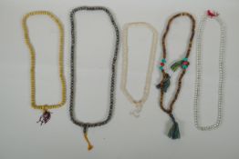 Five strings of Tibetan Mala beads, including bone, nut kernel and glass beads, 82cm longest